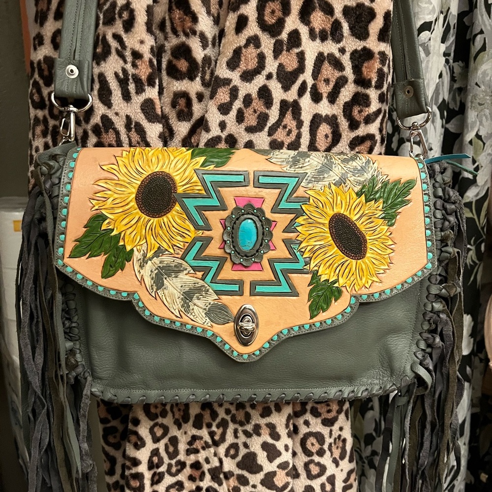 Hand made. One of a kind. Tooled leather. Paid over $400. Never used
